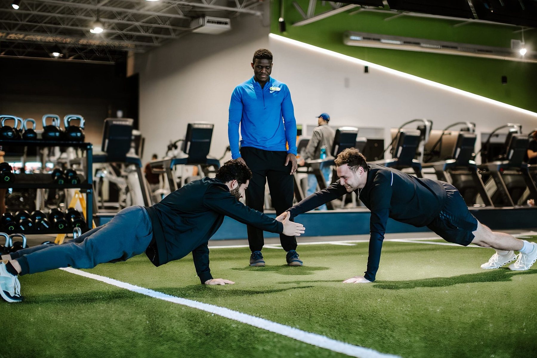 Member training on the gym floor